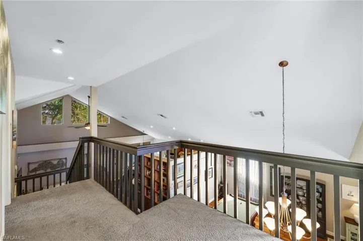 Dining room with vaulted ceiling and a healthy amount of sunlight