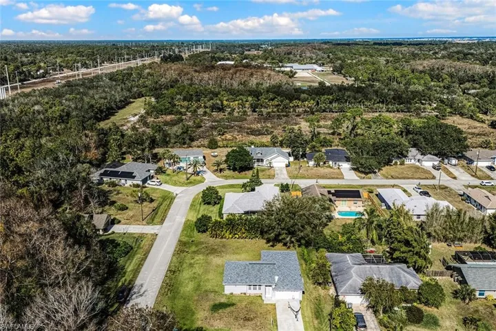 Aerial perspective of suburban area with a heavily wooded area