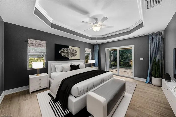 Bedroom with ornamental molding, a textured wall, light wood-type flooring, access to outside, and a ceiling fan