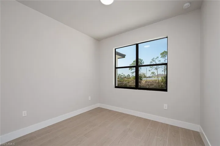 Unfurnished room with light hardwood / wood-style floors