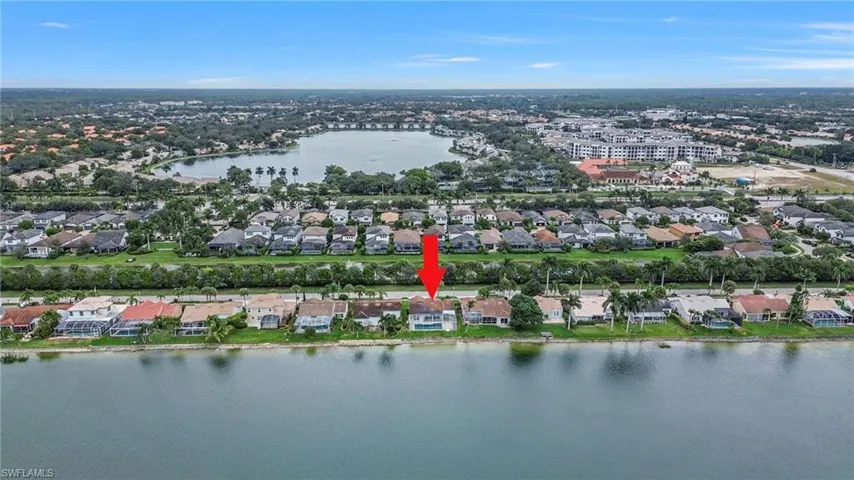 View of property location with a nearby body of water and nearby suburban area