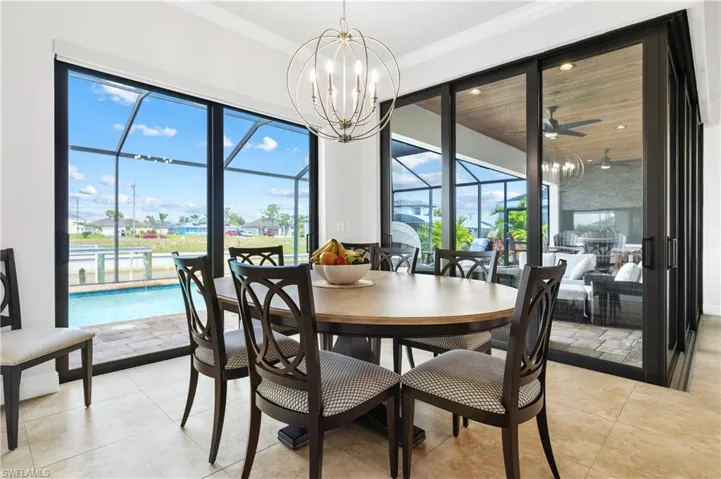 Dining room overlooks lanai and pool