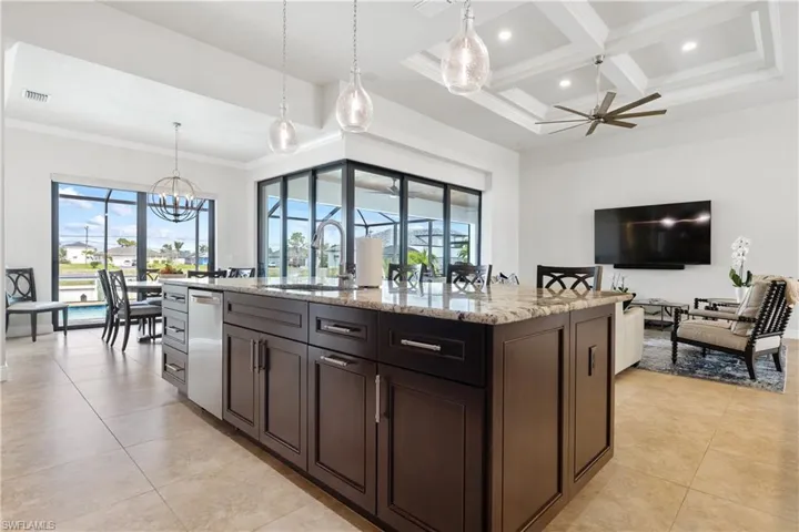 Kitchen overlooks lanai and pool