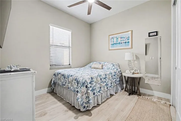 Bedroom featuring light wood-style flooring and ceiling fan