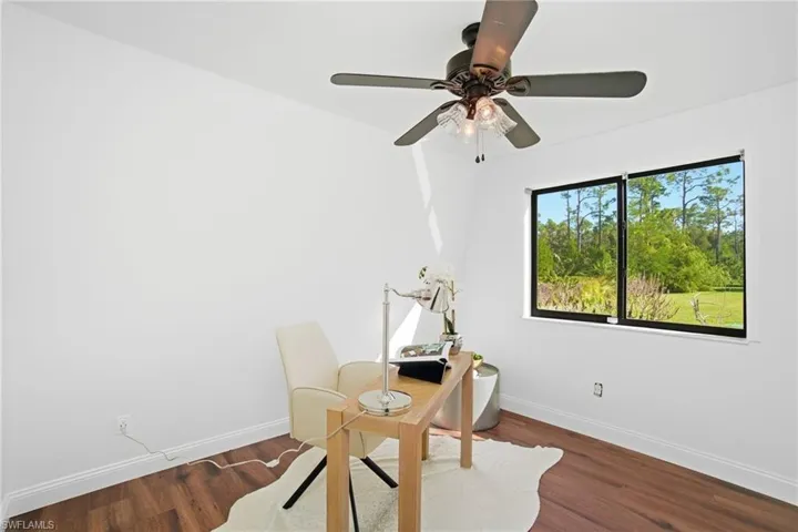 Downstairs is a 4th bedroom, which is staged as an office