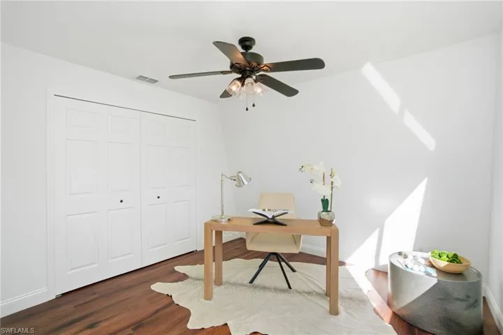 4th downstairs bedroom staged as an office.