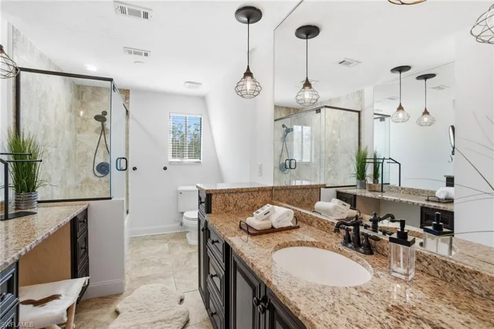 Main guest bathroom upstairs services two guest bedrooms that are adjacent in location. Separate makeup and sink vanity feel comfortable and spacious..