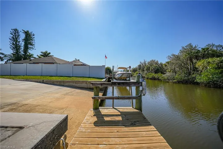 Dock area featuring a water view