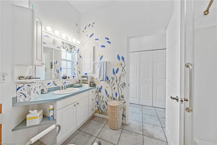 Bathroom featuring vanity and tile patterned floors