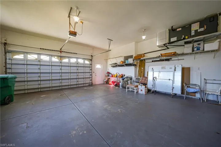Garage featuring a garage door opener