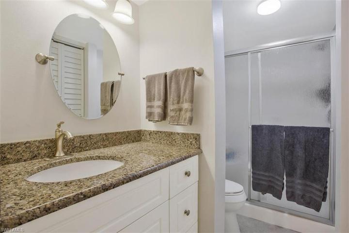 updated and upgraded cabinet, sink and commode  Walk in shower and a linen closet