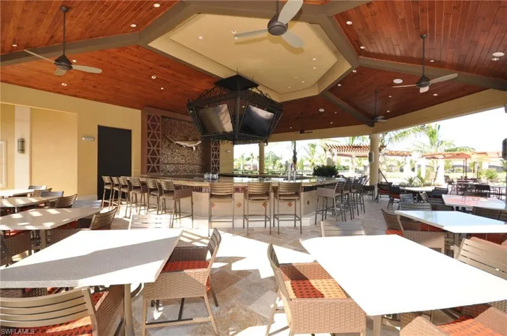 Dining room with ceiling fan and wood ceiling