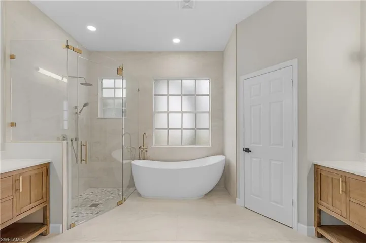 Primary Bathroom with Soaking Tub and Dual Vanities