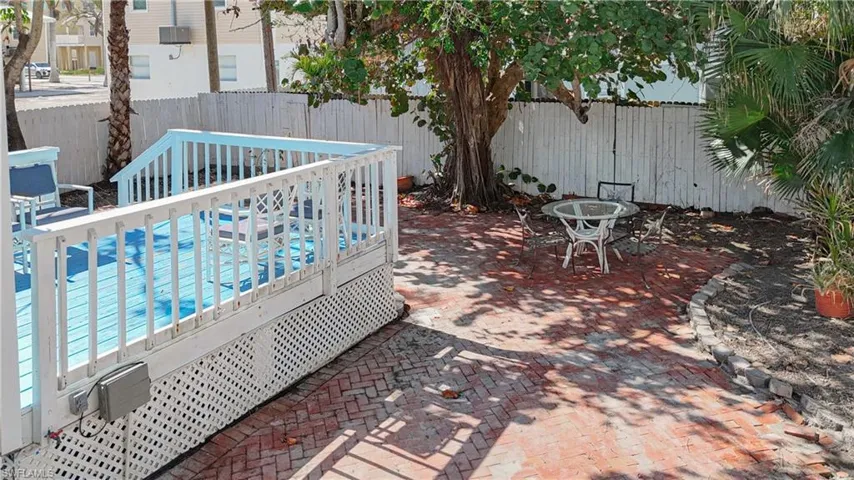 View of patio featuring a wooden deck