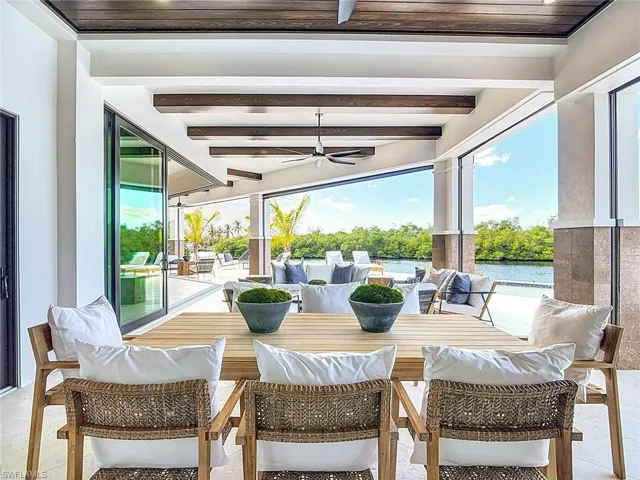 So much covered patio space with beautiful exposed beams.ff