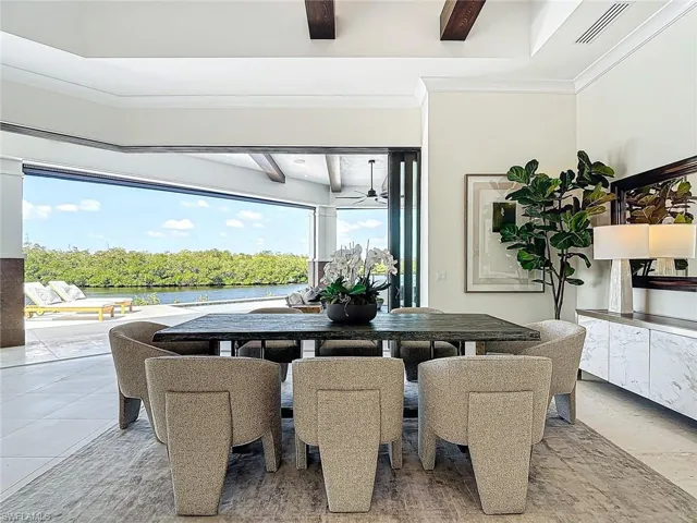 The dining area in the great room has a beautiful view of the wide canal.