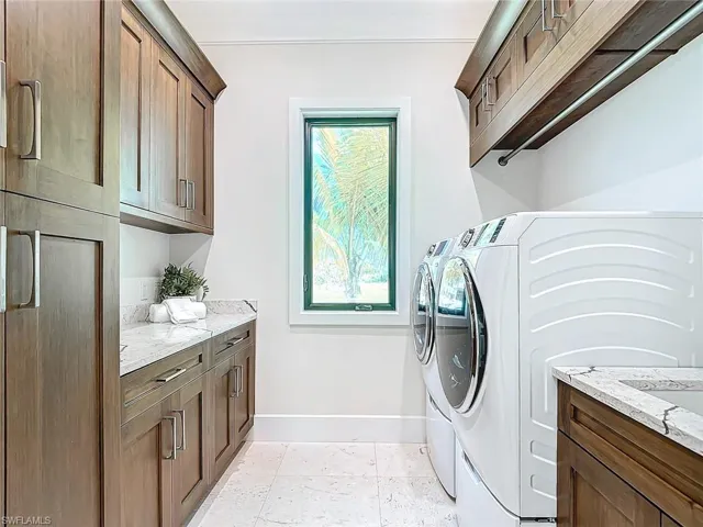 Large laundry room with tub in main house.