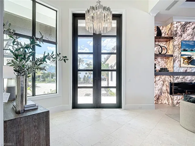 10 foot entry door to impress with chandelier which lowers for ease of cleaning.