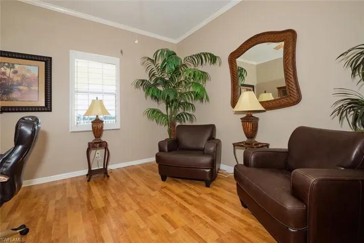 Sitting room featuring light hardwood / wood-style flooring and ornamental molding