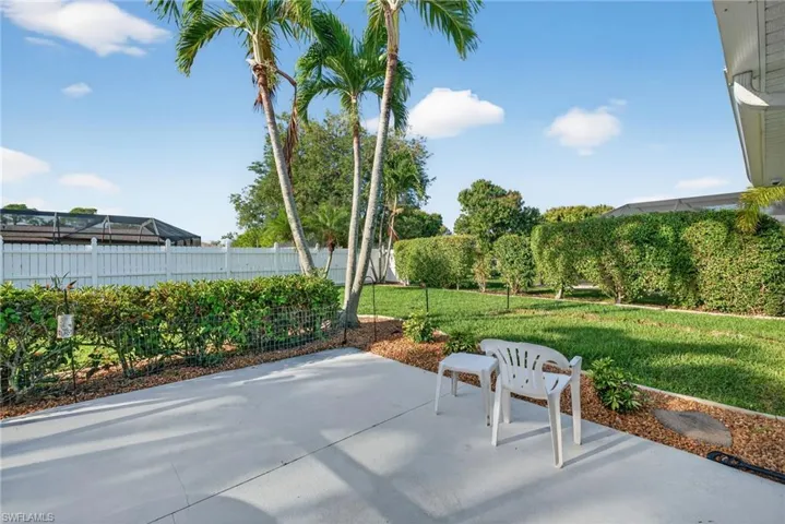 Fenced backyard featuring a patio
