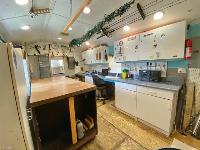 Nice and cool window AC with plenty of cabinets, an island on wheels for maximum workspace!