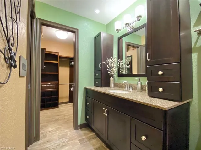 Master bathroom with a pocket door access from the bedroom.