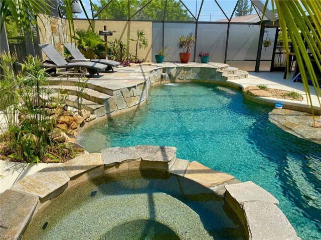 Resort style pool and spa boasting a 43' x 39' screened enclosure!