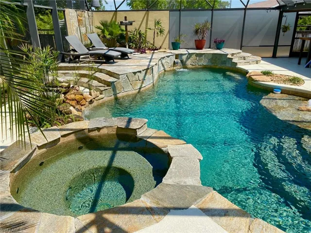 Resort style pool and spa boasting a 43' x 39' screened enclosure!