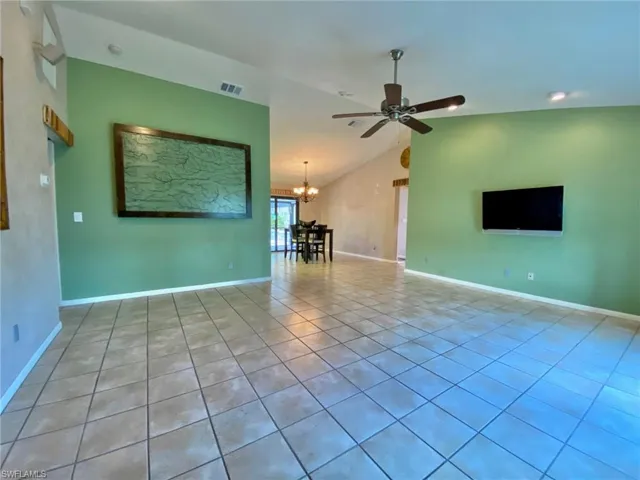 Living room with split bedroom floorplan, master bedroom and large laundry/mud room to the LEFT and guest bedrooms and bath to the RIGHT.