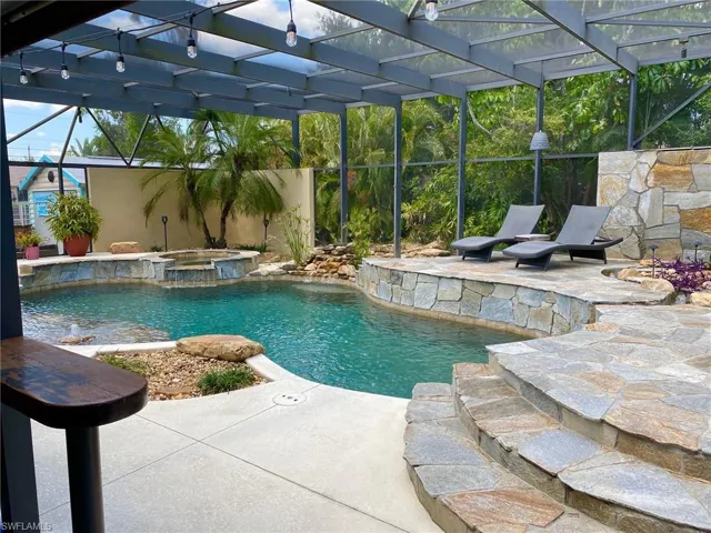 View of the pool from the dart game area standing bar.