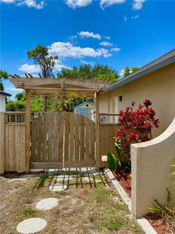 Custom built gates takes you to the hobby shed and pool