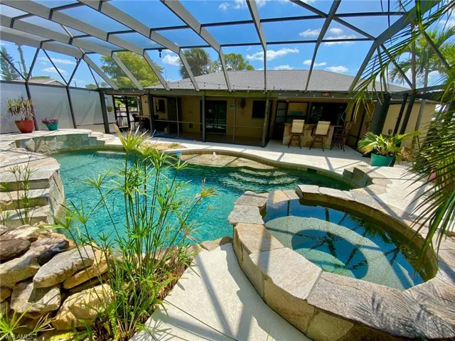 Resort style pool and spa boasting a 43' x 39' screened enclosure!
