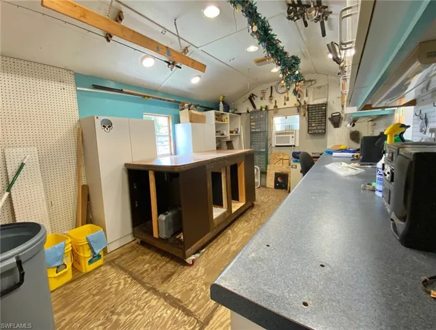 Nice and cool window AC with plenty of cabinets, an island on wheels for maximum workspace!