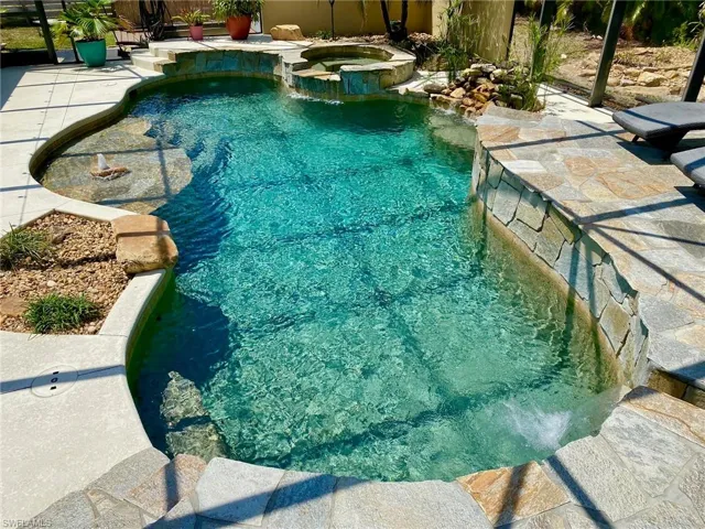 Resort style pool and spa boasting a 43' x 39' screened enclosure!