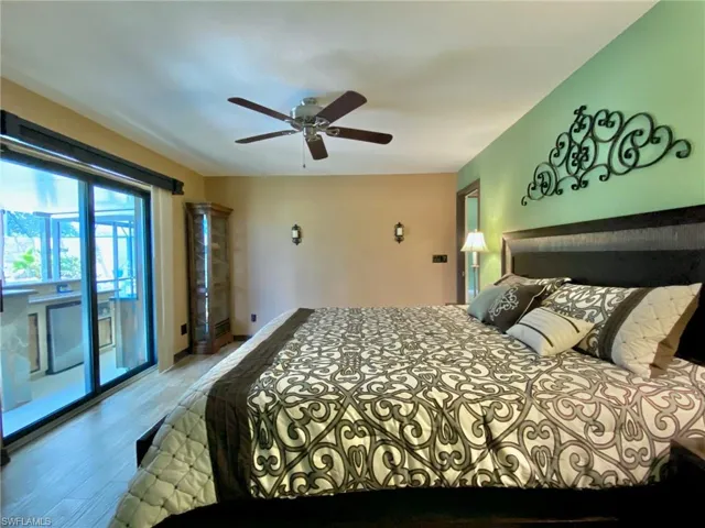 Spacious master bedroom with sliders to the wet bar and pool!