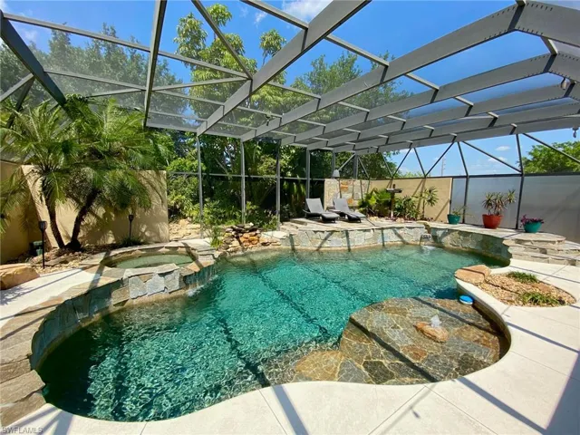 Resort style pool and spa boasting a 43' x 39' screened enclosure!
