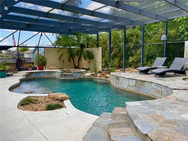 Resort style pool and spa boasting a 43' x 39' screened enclosure!