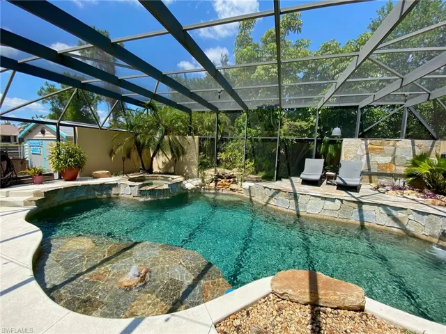 Resort style pool and spa boasting a 43' x 39' screened enclosure!