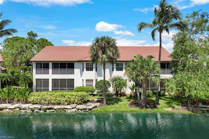 One-of-a-kind opportunity to own a spacious carriage home in NAPLES with a scenic lake view.