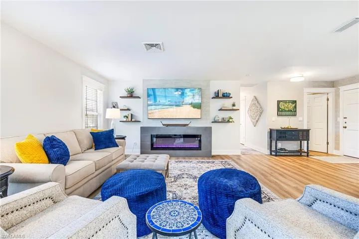 Open-concept living area with wood-finish flooring