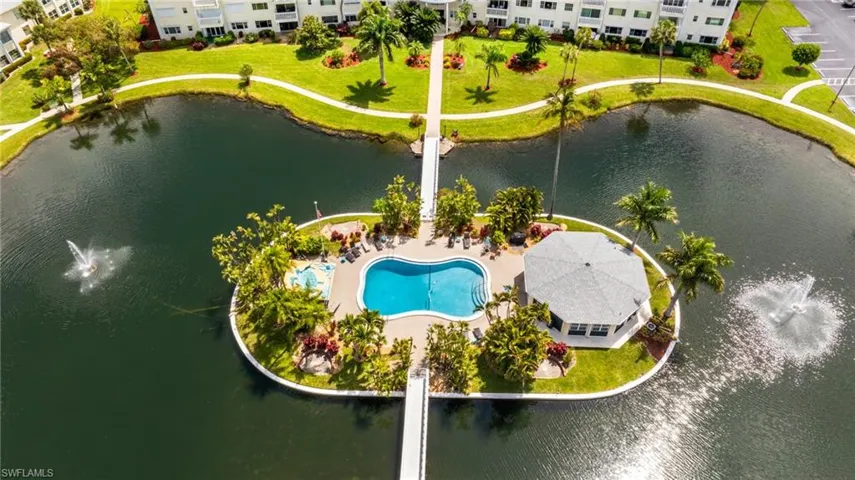 Central island amenity area featuring a kidney-shaped pool, separate spa, and a hexagonal gazebo