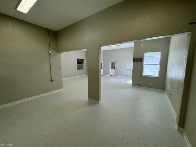 Unfurnished room with light tile patterned flooring