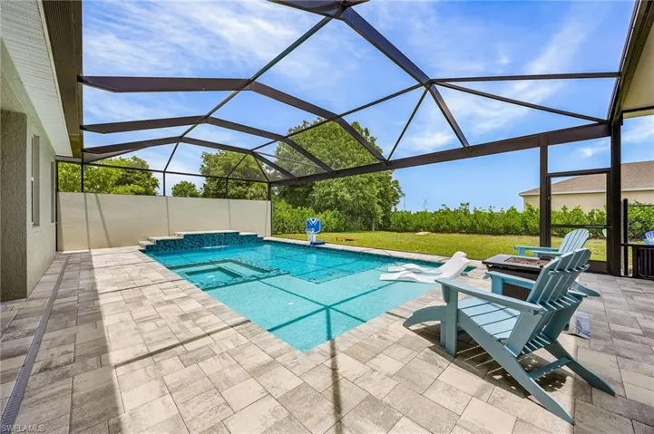 Incredible custom heated saltwater pool and oversized spa—highly desirable features for buyers seeking a luxury Cape Coral pool home.   Fully automated with use of a smartphone app.  Turn the spa on, hit the lights, turn on the waterfall, all from your phone.