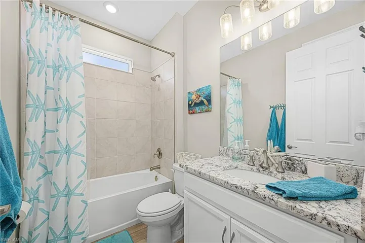 Full guest bathroom featuring modern finishes, updated fixtures, and a clean, contemporary design ideal for everyday use or accommodating guests.  Located between the 2 guest bedrooms.