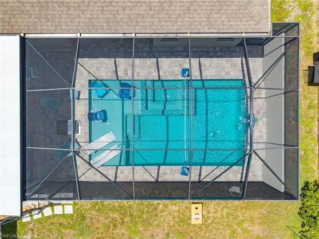 Aerial view highlighting the custom pool, cabana, and backyard design—perfect for buyers searching for luxury outdoor living in Cape Coral.
