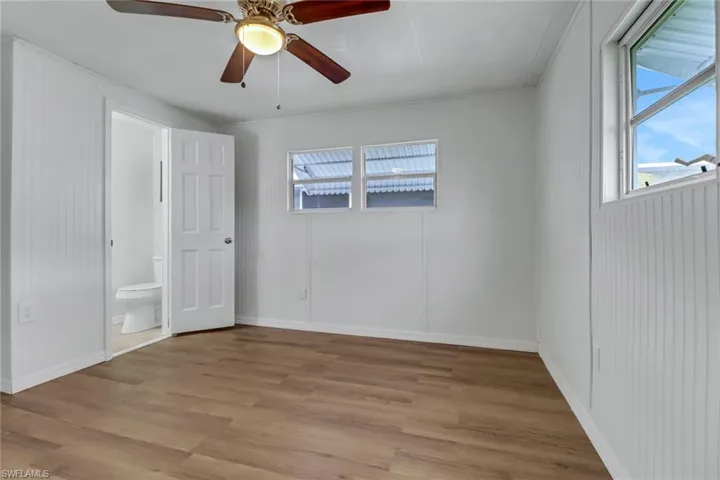 Primary Bedroom with Luxury Vinyl Plank Flooring