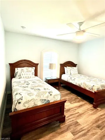 Bedroom 3 featuring hardwood / wood-style floors and ceiling fan
