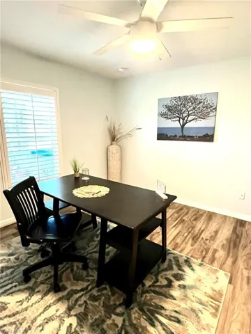 Bedroom 2 featuring wood-type flooring and ceiling fan