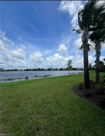 View of yard with a water view