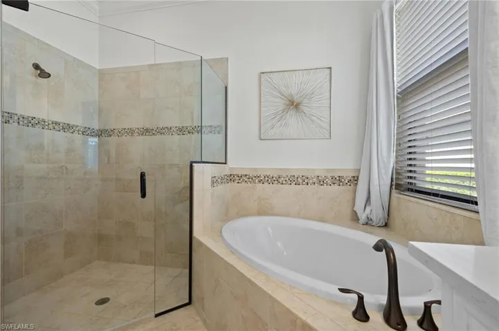 Bathroom featuring independent shower and bath